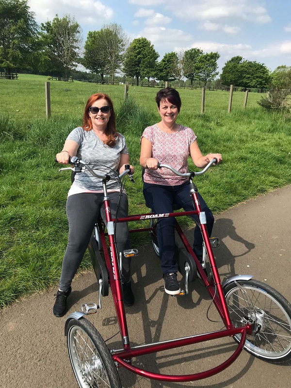 Kate and Linda on a two person bicycle